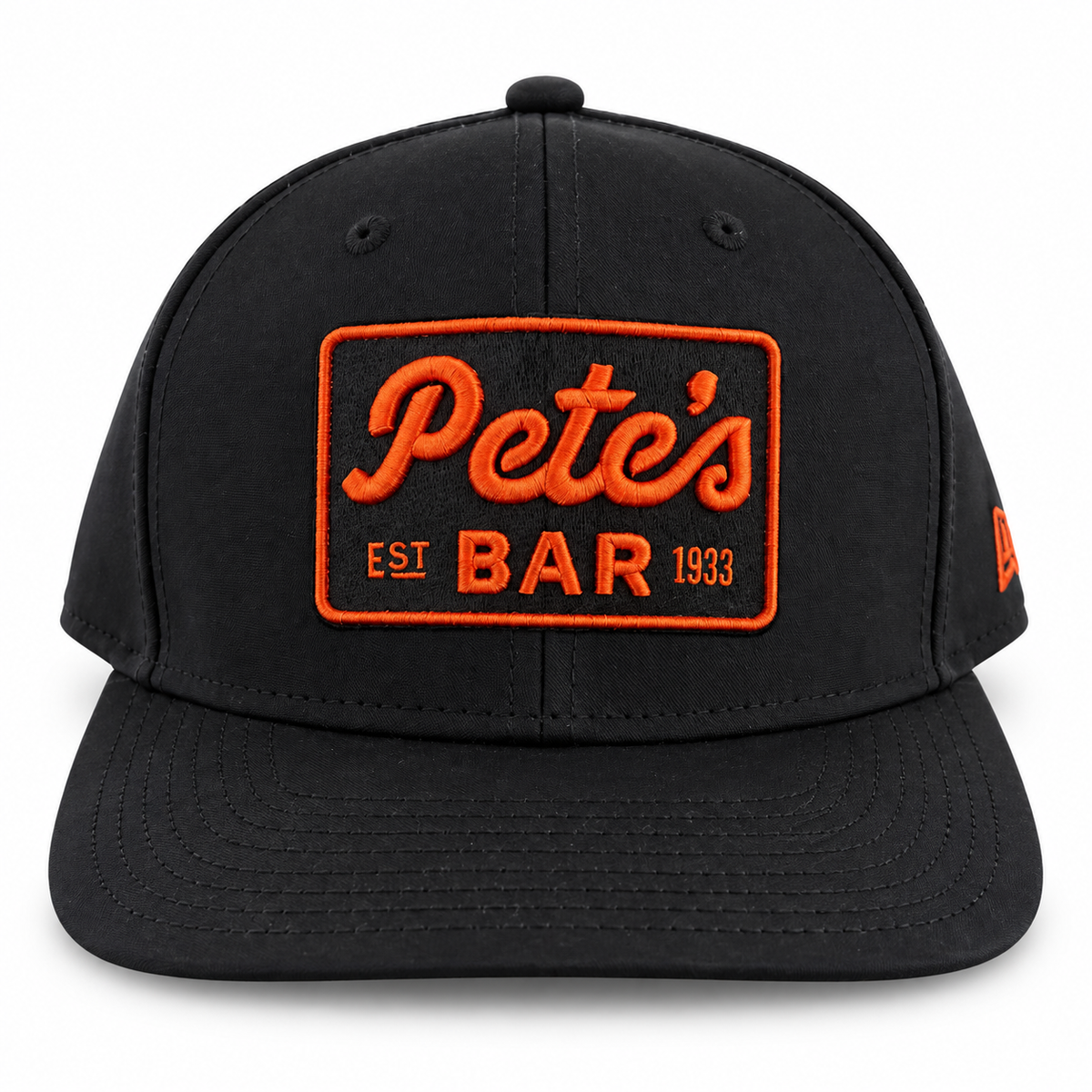 Pete's black snapback hat with orange logo, front view